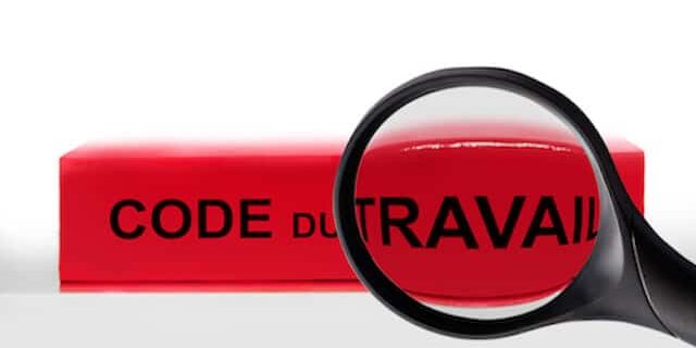 code du travail Code du travail français avec un loupe agrandissant le mot travail